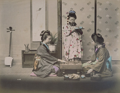 Women and a girl playing go
